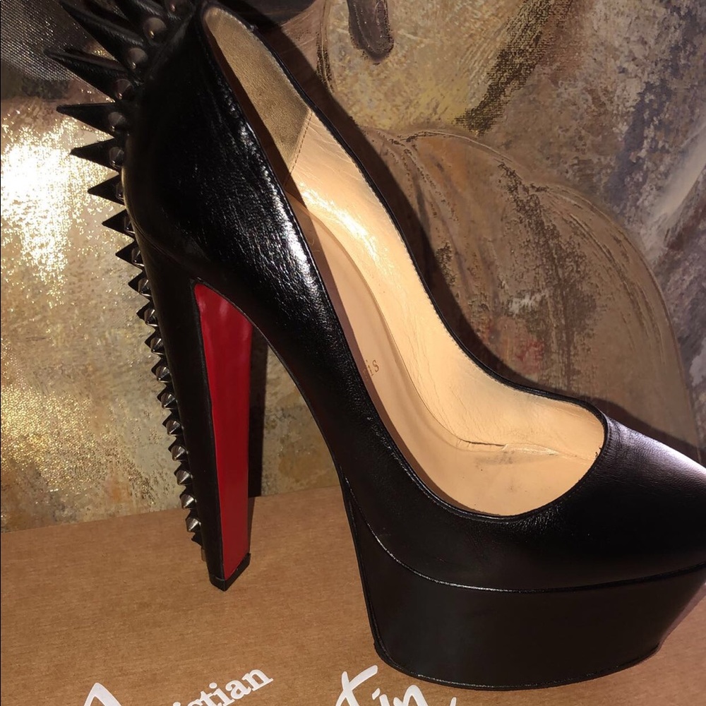 Lou bouton black heels.